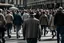 Placeholder: hombre caminando por el centro de una ciudad entre personas que vienen y van- Fotografía realizada con cámara Leica y objetivo 50 mm.