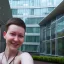 Placeholder: A short haired, female software engineer taking a selfie in front of Building 92 at Microsoft in Redmond, Washington