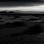 Placeholder: black desolate desert landscape