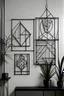 Placeholder: Create a realistic image of metal wire wall art with geometric figures, shapes and designs in a frame of same thickness of metal wire. Keep it simple with large spaces in between and use geometric composition