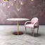 Placeholder: Light pink swirling marble texture,centered table & chair, soft shadows, HD 4K Unreal Engine 5 bokeh