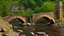 Placeholder: stone and brick bridge across a rocky ravine