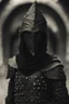 Placeholder: hooded man wearing studded leather armor