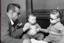 Placeholder: a photo of baby Simone de Beauvoir and baby Jean-Paul Sartre meeting baby Che Guevara who is lighting a cigar for baby Jean-Paul Sartre