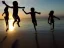 Placeholder: children jumping in water on a beach capture them against the sun and make an art silhouette, hyper details, real sharp, 8k, well detailed, well shaped