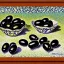 Placeholder: black olives in style of signac