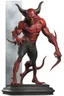 Placeholder: Realistic devil leaning forward at an angle facing left, posed as if over a shoulder, red skin, horror style, no other person.