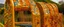 Placeholder: A golden orange colored bridge made out of xylophones designed in Moai statues painted by Gustav Klimt