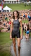 Placeholder: anorexic beautiful woman, age 21, total shot, anthracite triathlon swimsuit, medium long wavy bob haircut, brunette hair, blurred party crowd in background