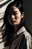 Placeholder: asian model ,minimal high-resolution photograph, woman, stunning use of shadows, in the syle of crisp lines and forms, UHD, shot on a Sony A7III --ar 1:2 --style raw --stylize 250