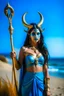 Placeholder: A picture of a beautiful blue faced indian goddess with skin painted blue, blue painted body, blue painted torso, wild black hair, stag antlers, elven ears, golden skirt, holding a staff on a sunny beach