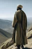 Placeholder: A general in Arab clothing standing from behind on a mountain, his face not visible