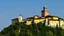 Placeholder: Huge medieval monastery at the top of a hill in northern Italy