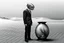 Placeholder: imitating analog photography in black and white, man with a fish tank instead of a head, three-piece suit, in a desert, realism, pen painting style