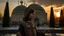 Placeholder: A Palestinian girl have wings wearing an embroidered dress with the Dome of the Rock in front of her during sunset in winter.