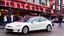 Placeholder: A Tesla's 'Model S Plaid' is doing donuts, at the 'Pike Place Market', in Seattle. CINEMATIC. WIDE ANGLE LENS. PHOTO REAL.