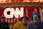 Placeholder: a group of clowns in front of the circus with a CNN logo
