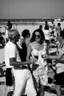 Placeholder: party on the beach of Porto Racanti in the middle of summer, music, dancing, celebration, toast, photography taken with a Leica camera and a 35 mm lens, black and white photography