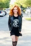 Placeholder: Debby Ryan, smiling, Heavy Metal t-shirt, Black Leather biker's jacket, midday, bright sunlight, extremely colorful. Big, fluffy hair, Debby Ryan has Auburn Red hair, green eyes, She is extremely well built.....Well endowed.