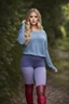 Placeholder: beautiful 18 year old girl with ash blonde hair and blue eyes with her curvy hair down, wearing a long-sleeved woollen top, and lilac long leggings, with long red boots full body shot