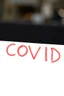 Placeholder: "COVID" crit en rouge en capital comme sur l'image