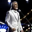Placeholder: create a image showing Andrea Bocelli, resplendent in a crisp white suit, awaits a special guest on stage. Suddenly, Celine Dion emerges in a sparkling silver dress. Together, they deliver a history-making balladcreate a image showing Andrea Bocelli, resplendent in a crisp white suit, awaits a special guest on stage. Suddenly, Celine Dion emerges in a sparkling silver dress. Together, they deliver a history-making ballad