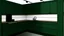 Placeholder: kitchen with dark green furniture, forest wallpaper on a white wall, on the left side next to the window there is a microwave and oven installed in the furniture, and on the right side 5 cm from the induction hob and a kitchen hood above it,