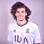 Placeholder: 85mm DSLR color photography of a very detailed headshot fitting all of head and hair in frame. 20-year-old English soccer player, with black hair color and with small facial hair and is black with a small smile, grey background