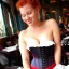 Placeholder: beautiful woman at lunch wearing a corset sexy