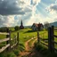 Placeholder: Prompt: create a realistic image: "A picturesque, rural village with an old church and a traditional half-timbered house on a gentle hill. The scene features a rustic wooden fence in the foreground framing a green meadow with white geese. The sky is dramatic with large, white clouds, and rays of sunlight break through to bathe the landscape in a warm glow. The path leading to the church and house is interspersed with grass and earth, giving the scene an idyllic and nostalgic atmosphere. Style in
