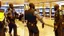 Placeholder: 2 security officers force upset man in suit to leave airport lounge