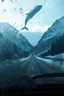 Placeholder: surreal mountain road seen through a dirty truck front window, dirty blue snow and wind, a giant whale hanging in the sky