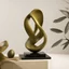 Placeholder: An olive kernel-inspired sculpture, rendered in a contemporary, abstract style.