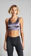 Placeholder: photography of a beautiful anorexic woman, grey satin triathlon top, sports illustrated, blond short wavy bob haircut, pronounced sternum, flat chest, anthracite cycling leggins