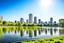 Placeholder: Sunny day, distant modern city, lake, lake reflections, people