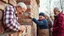 Placeholder: Elderly pensioners building a wall. Everyone is happy. Photographic quality and detail, award-winning image, beautiful composition.