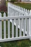 Placeholder: white vinyl fence in yard, photograph