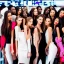 Placeholder: photo of a group of beautiful models wearing high fashion clothes posing and smiling on the dow jones trading floor, bankers busy working in the background, big smile, balenciaga, yeezy season, photorealistic photography, colourful, high contrast, in an office, dow jones, trading floor, fashion photography, high resolution, 8k, moody, hard light, gen z, wide angle lens