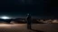 Placeholder: Man standing in the desert at night