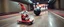 Placeholder: gnome on speeding on a sled in front of bowling ball heading for a strike, motion blur, heading for collision