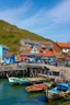 Placeholder: medieval fishing town, rocks, long piers, fishing boats, shops, blue sky