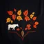 Placeholder: an autumn colored textured cloth embroidered ornamental leaves and cattle, pointed bottom, on dark background, Canadian western cowboy style