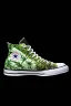 Placeholder: A red converse sneaker with weed leaves printed on the material, green, yellow and red colors