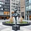 Placeholder: photo of a statue of ballerina made of black marbel in a modern city center
