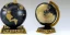 Placeholder: fantasy world globe, black marble, pearl inlay, fine gold detail, marginalia