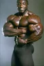 Placeholder: Bodybuilder Lee Haney .He wears a black suit