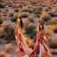 Placeholder: Isane pretty young woman Top Model in a stunning maximalist long flowy tribal dress, vogue, 8k, ektar, joshua tree, fashion. golden hour cinematic, rebecca guay, frank frazzeta