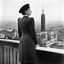 Placeholder: The famous photo of Marina Ginestà, taken by Juan Guzmán on July 21, 1936, captures a striking moment during the early days of the Spanish Civil War. In the image, Ginestà stands confidently atop the Hotel Colón in Barcelona, a backdrop of the city visible behind her. She is dressed in a stylish military outfit, a symbol of her involvement in the anarchist movement. Her posture is assertive, with one hand resting on a wall and the other holding a rifle, embodying both strength and defiance.