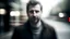 Placeholder: A portrait of a blurred man