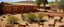 Placeholder: Brown semi-desert grounds with animals painted by Frank Lloyd Wright